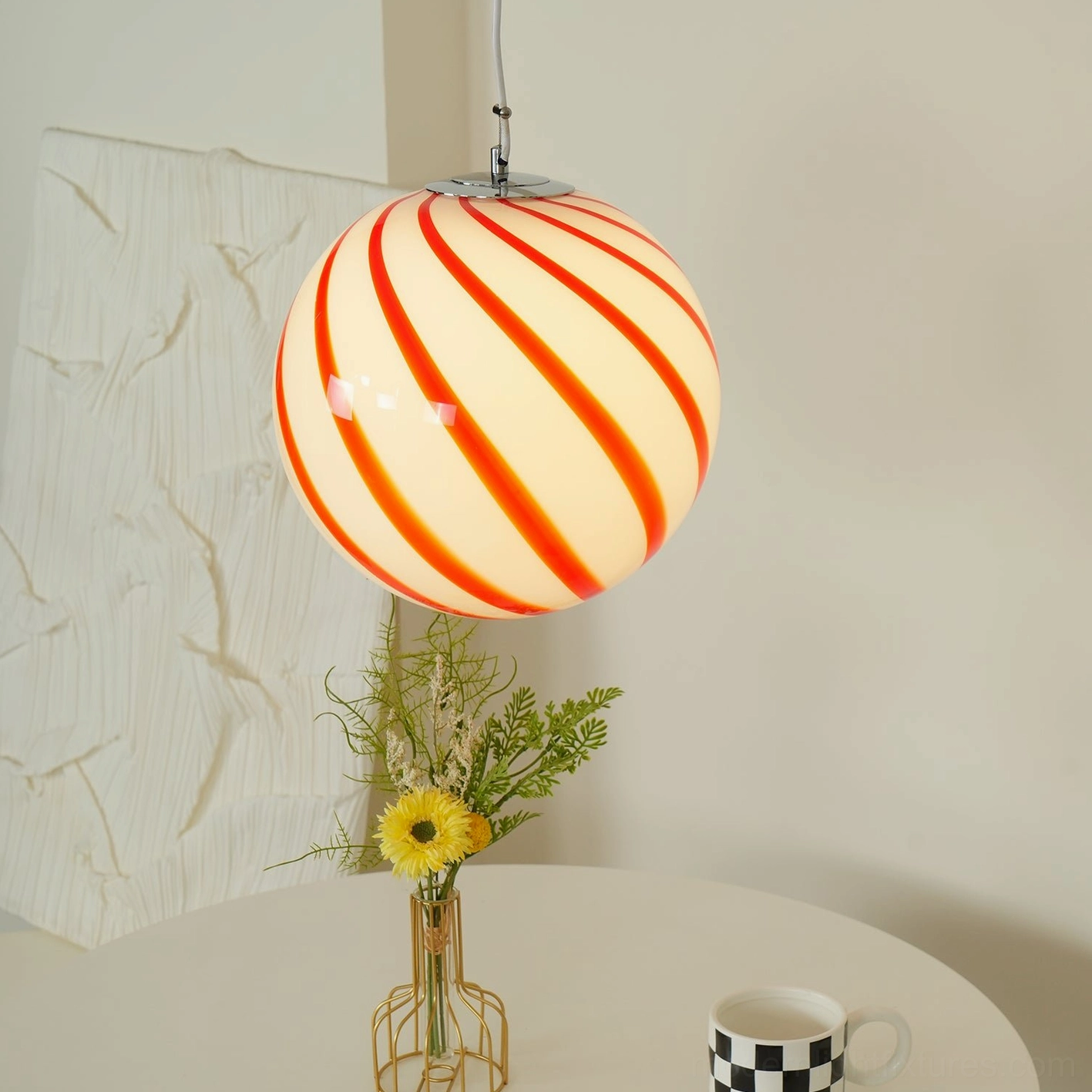 Hand-blown glass spiral stripe pendant lamp with metal suspension hardware and adjustable wire for flexible ceiling installation