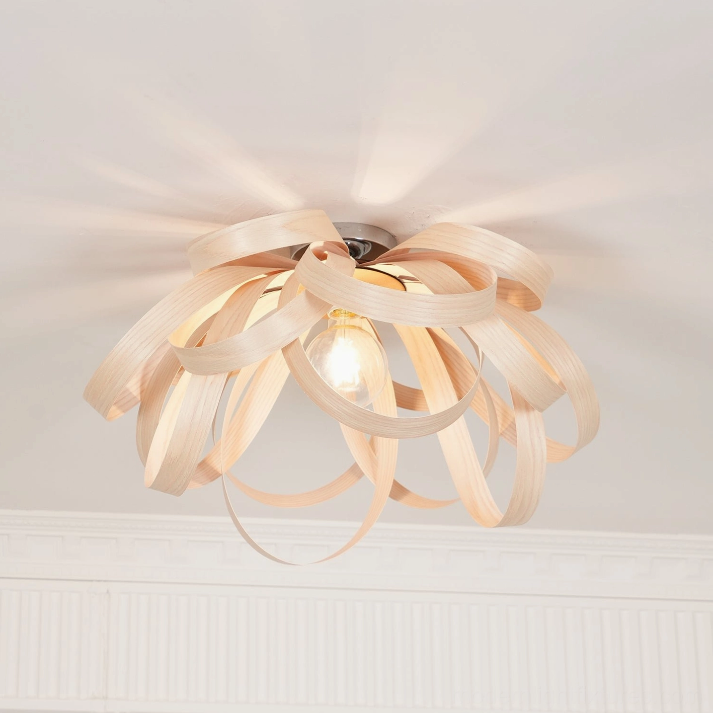 Modern wood spiral ceiling light natural finish overhead perspective