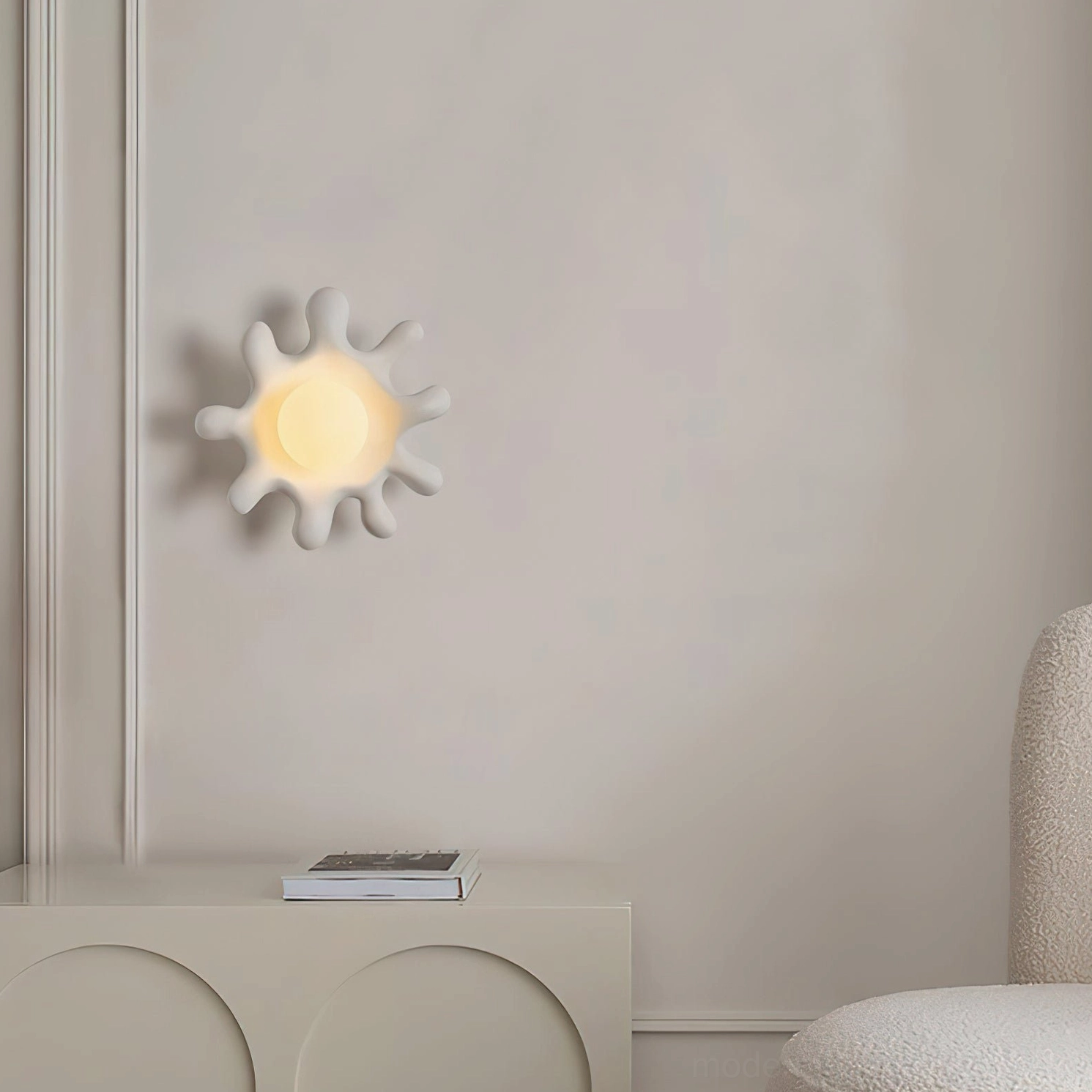 Splova cream wall sconce mounted in minimalist bathroom vanity area