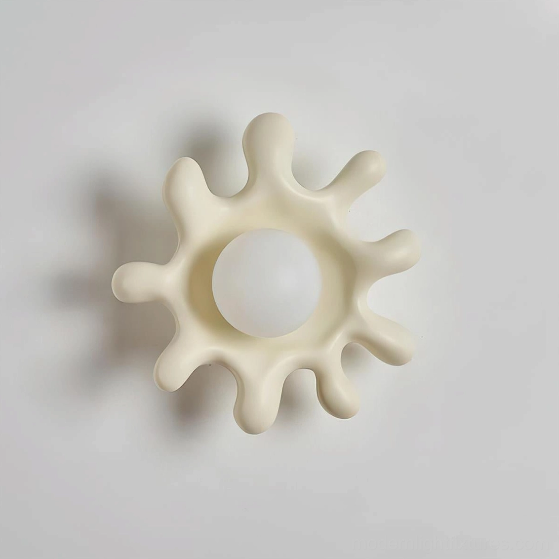 Splova cream finish wall sconce in soft minimalist interior aesthetic