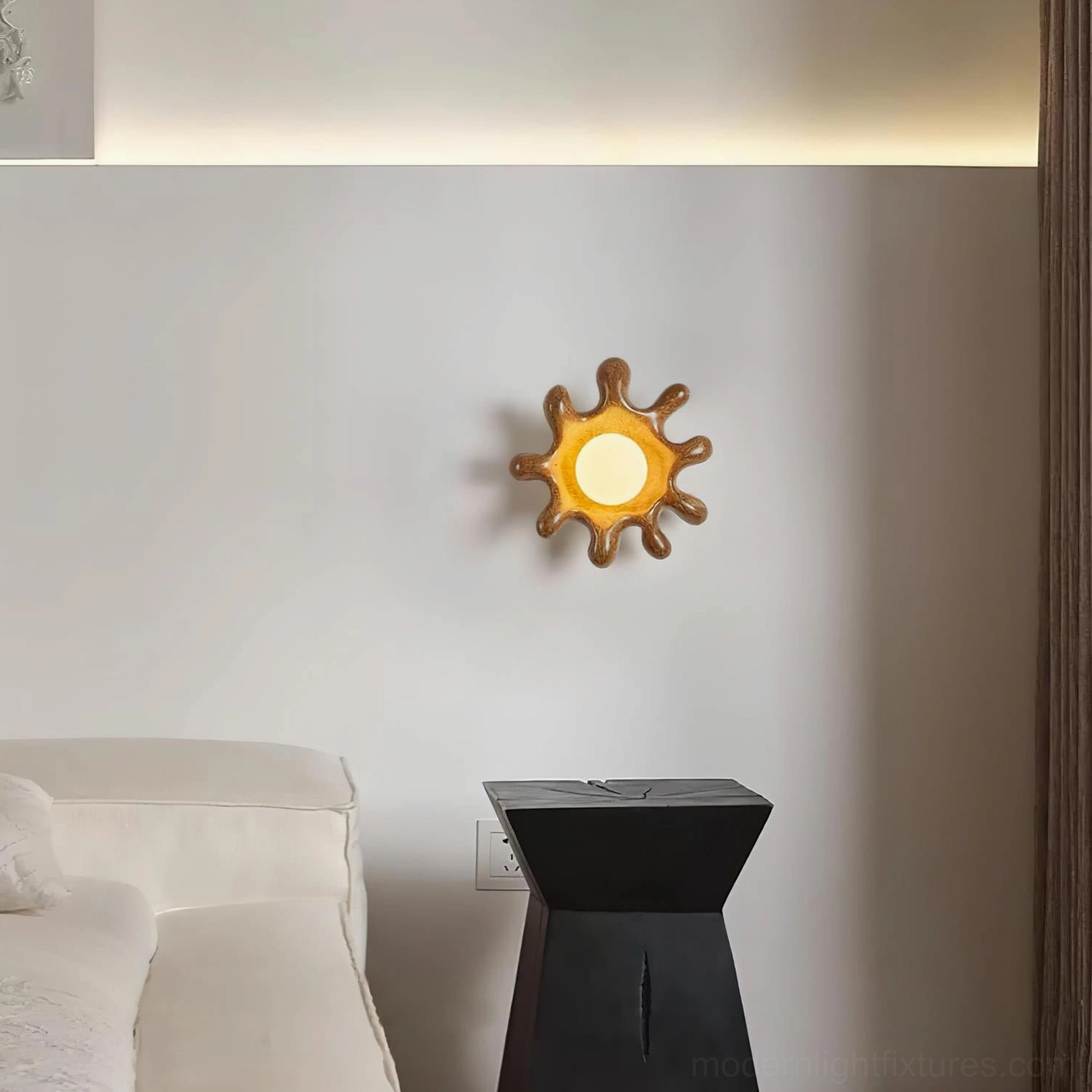 Splova sculptural wall sconce in bedroom corner creating warm ambient lighting with wabi-sabi aesthetic