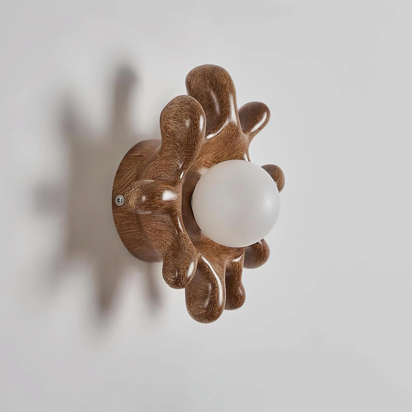 Splova modern wall sconce side profile showing sculptural depth and mounting hardware