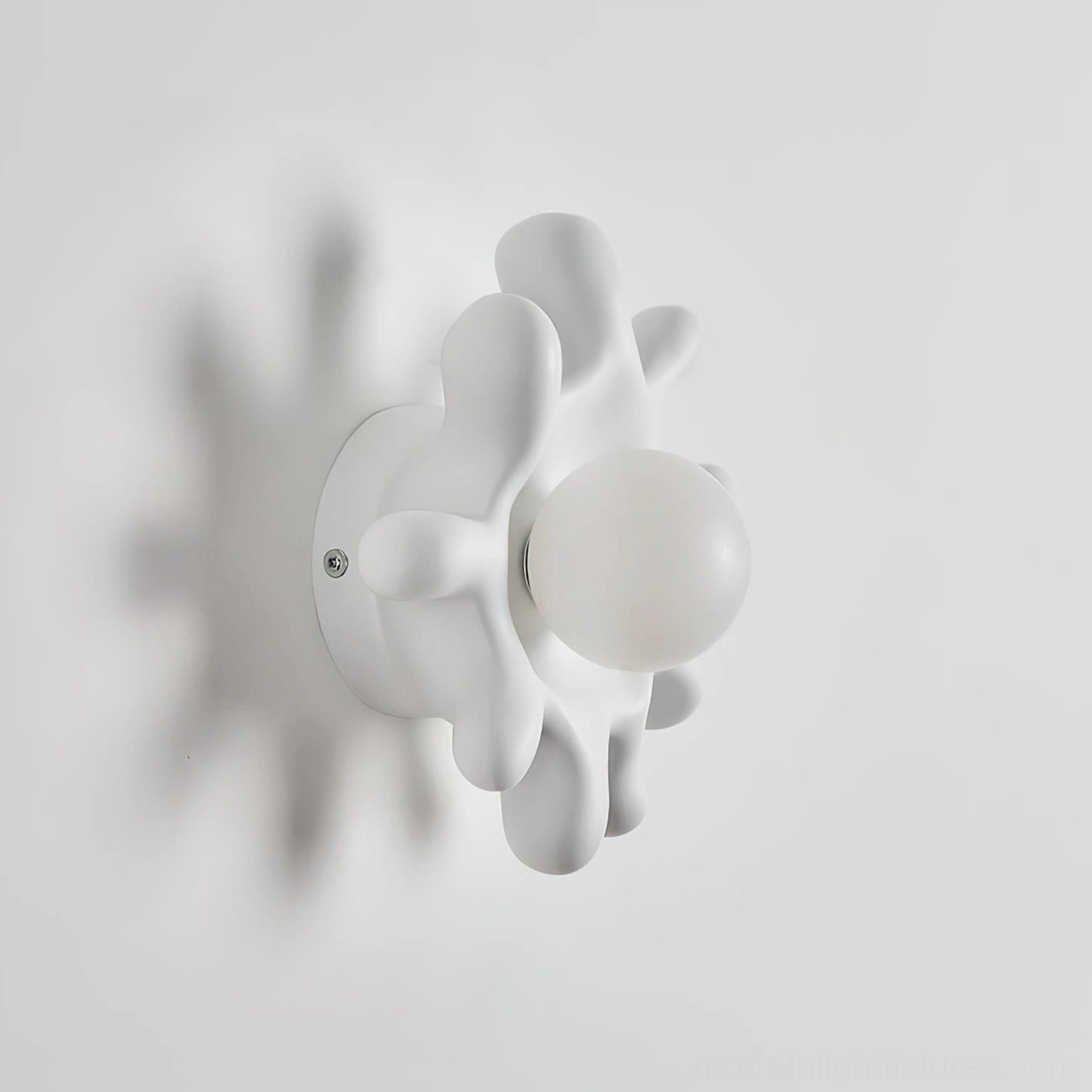 Splova white wall sconce in minimalist Scandinavian interior setting