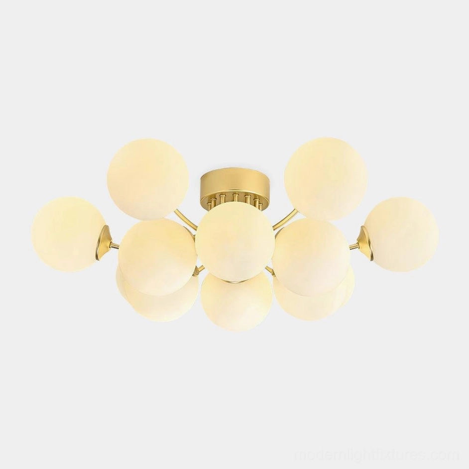 Multi-ball sputnik ceiling light front view with brass gold frame and frosted glass globes - modern mid-century design