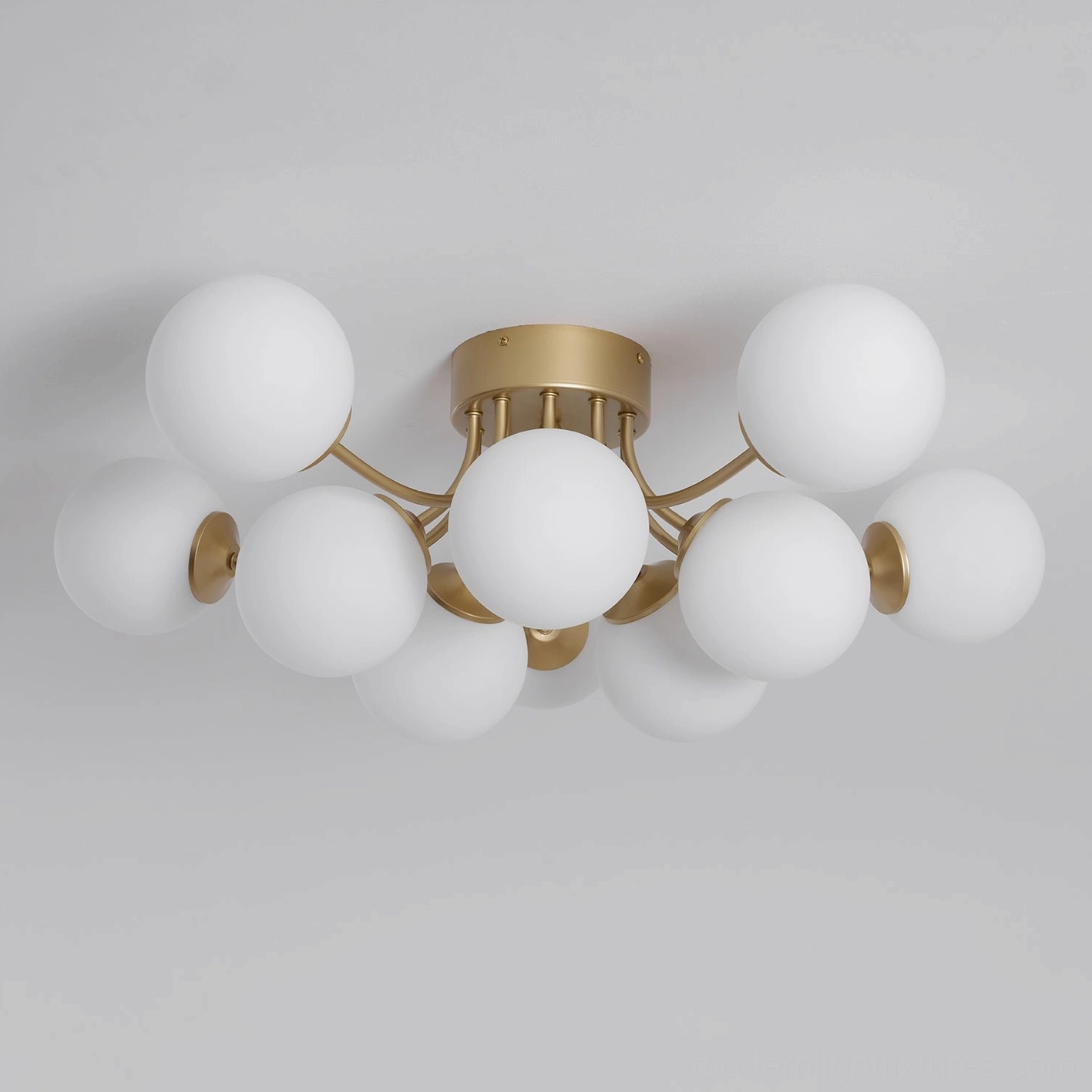 Sputnik ball ceiling light showing brass gold finish and geometric starburst design pattern