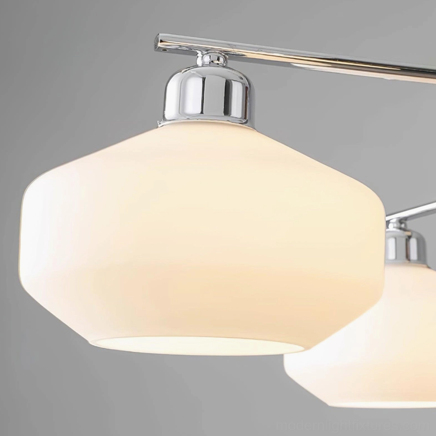 Sputnik chandelier with branching arms and opal glass shades creating soft ambient glow