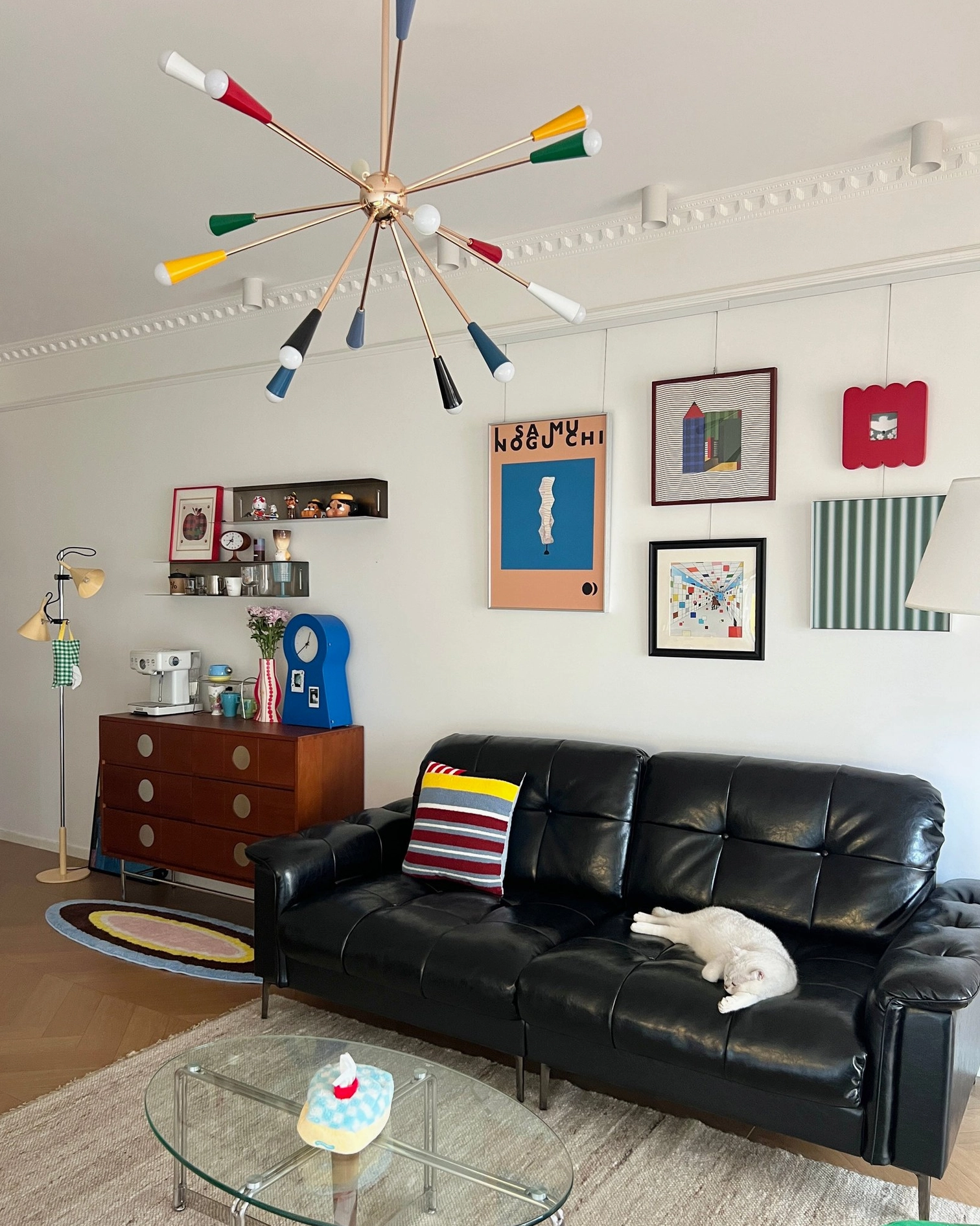 Sputnik burst chandelier upward ceiling view in eclectic residential living room with multicolor lamp heads