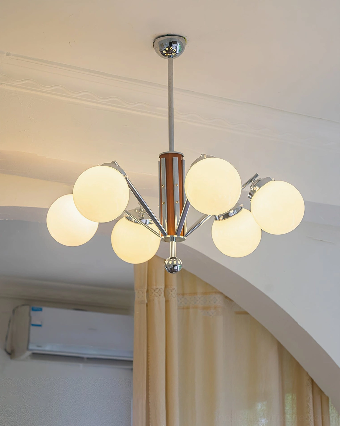 Sputnik chandelier close-up detail, chrome metal branching arms, walnut wood central column, frosted glass globes