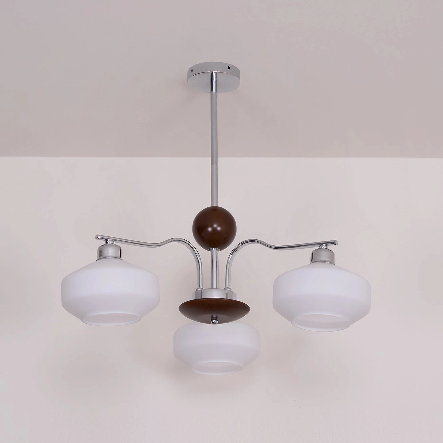 Retro sputnik chandelier front view with symmetrical branching arms and centered wood detail