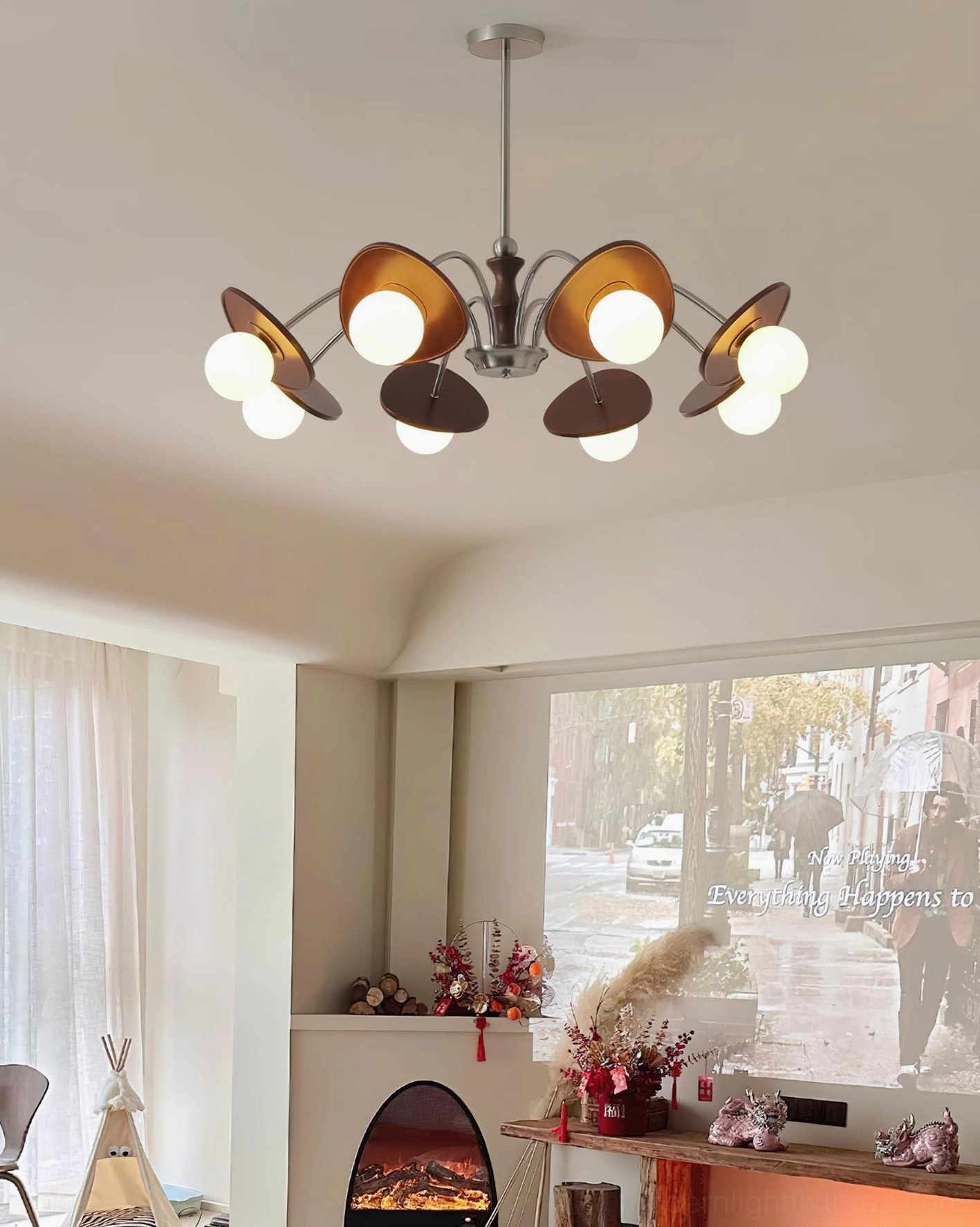 Lighted orbital chandelier creating warm ambient illumination in retro American living room with fireplace and vintage decor