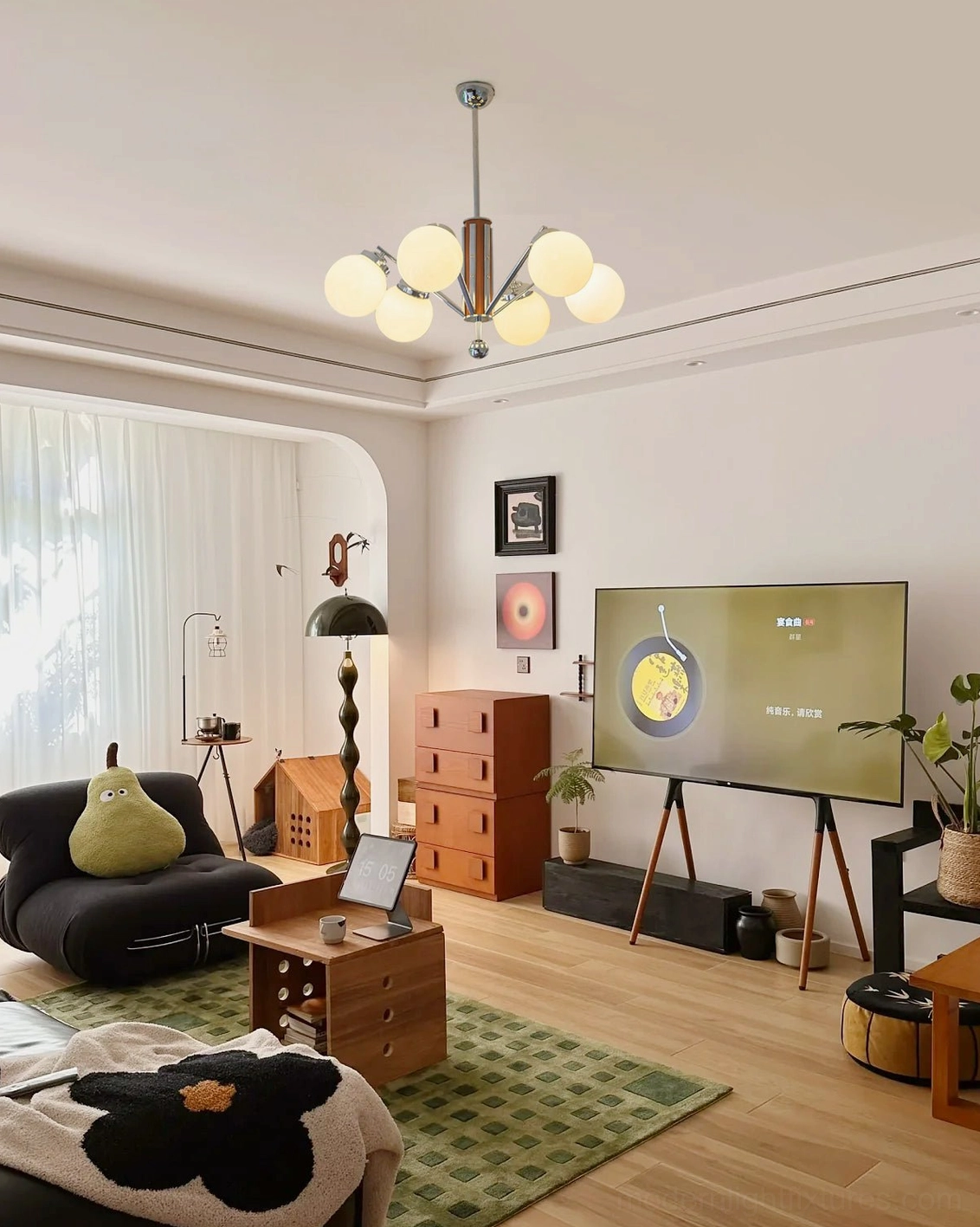 Sputnik chandelier ceiling-mounted in modern living room, warm glowing frosted glass globes, contemporary home lighting