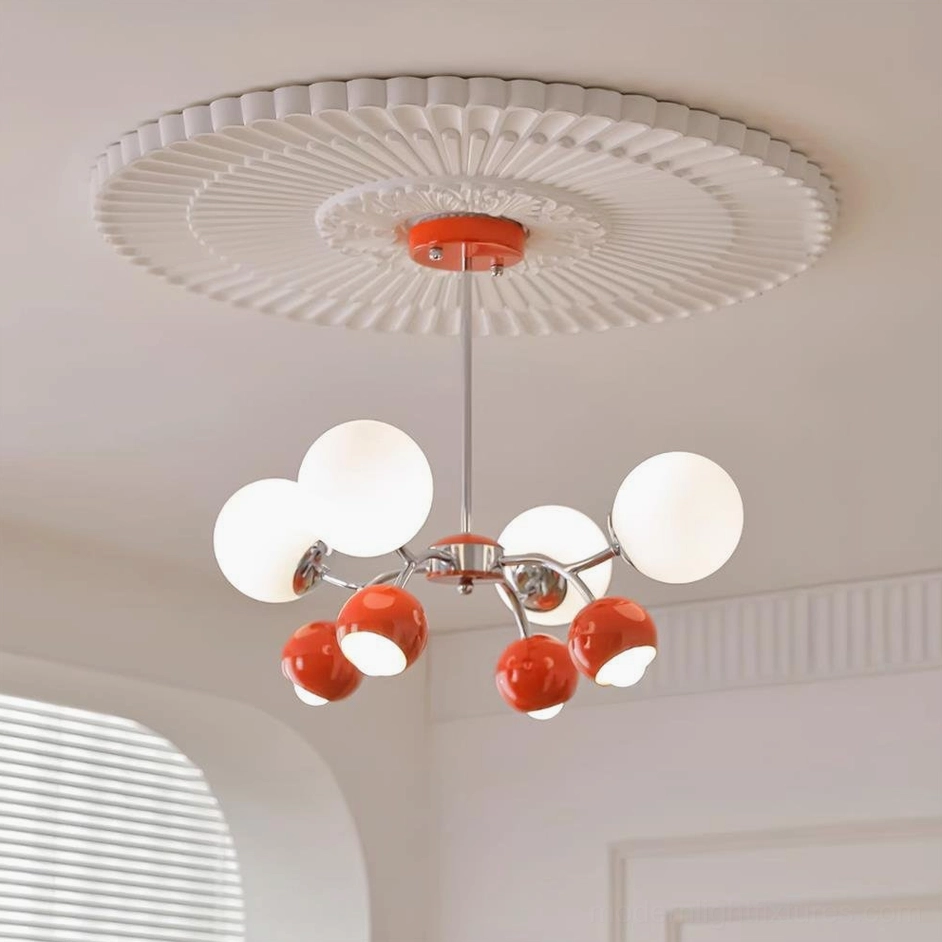 Sputnik pendant chandelier with orange and white frosted glass shades in modern interior setting
