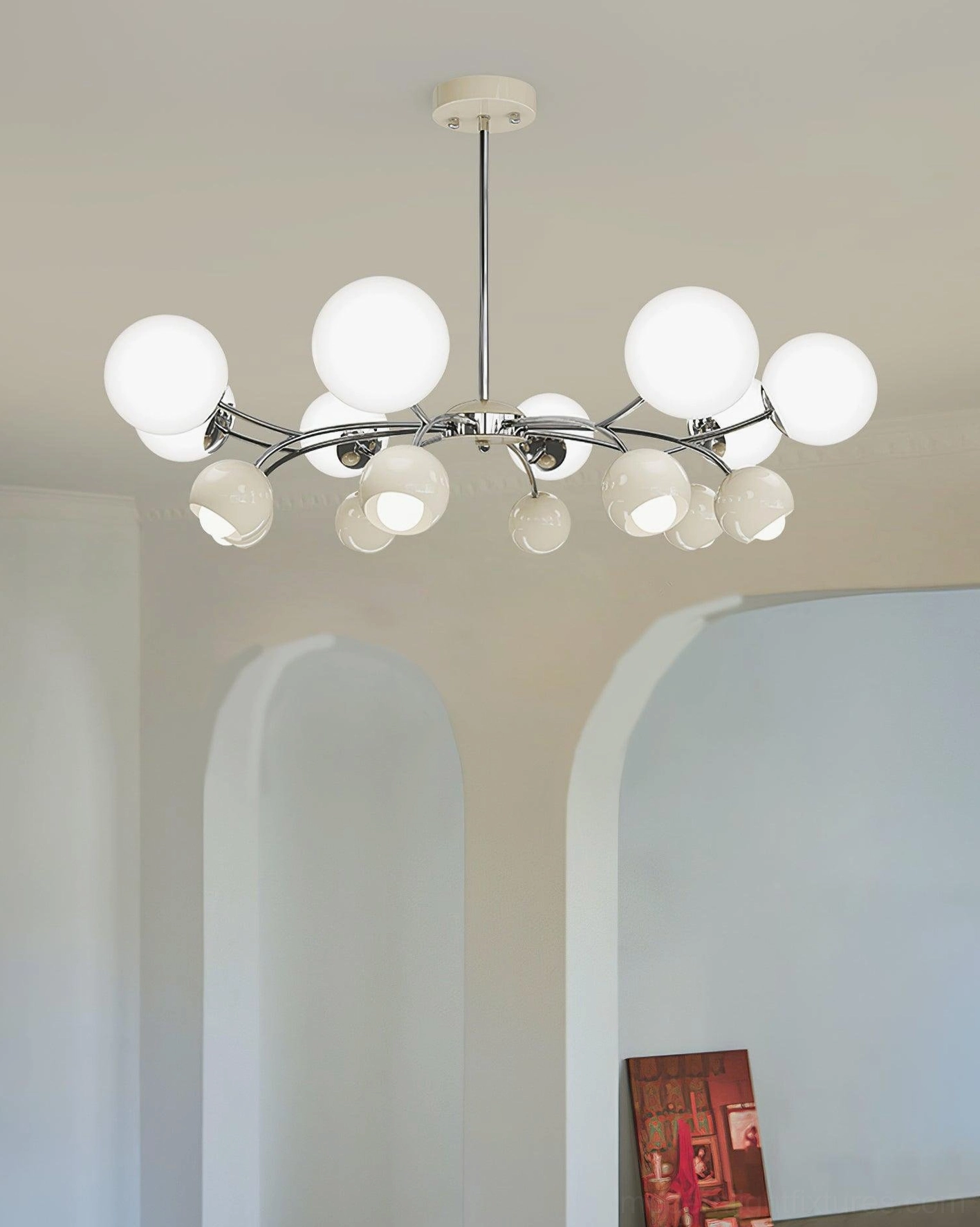 Modern Sputnik globe chandelier with all frosted white glass shades in archway interior space, polished chrome metal frame and arms