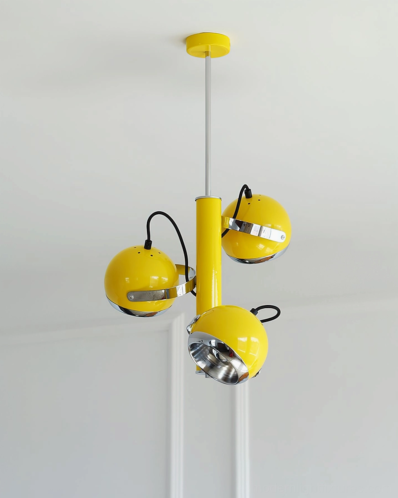 Yellow and red Sputnik pendant lamps styled together in modern gallery-inspired interior