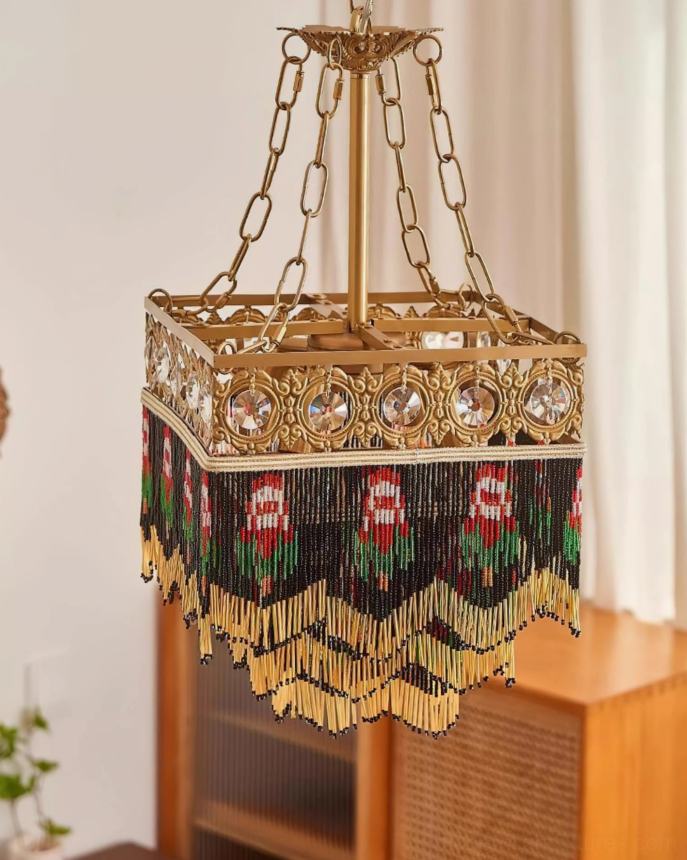 Square vintage chandelier with brass framework and decorative beaded fringe elements