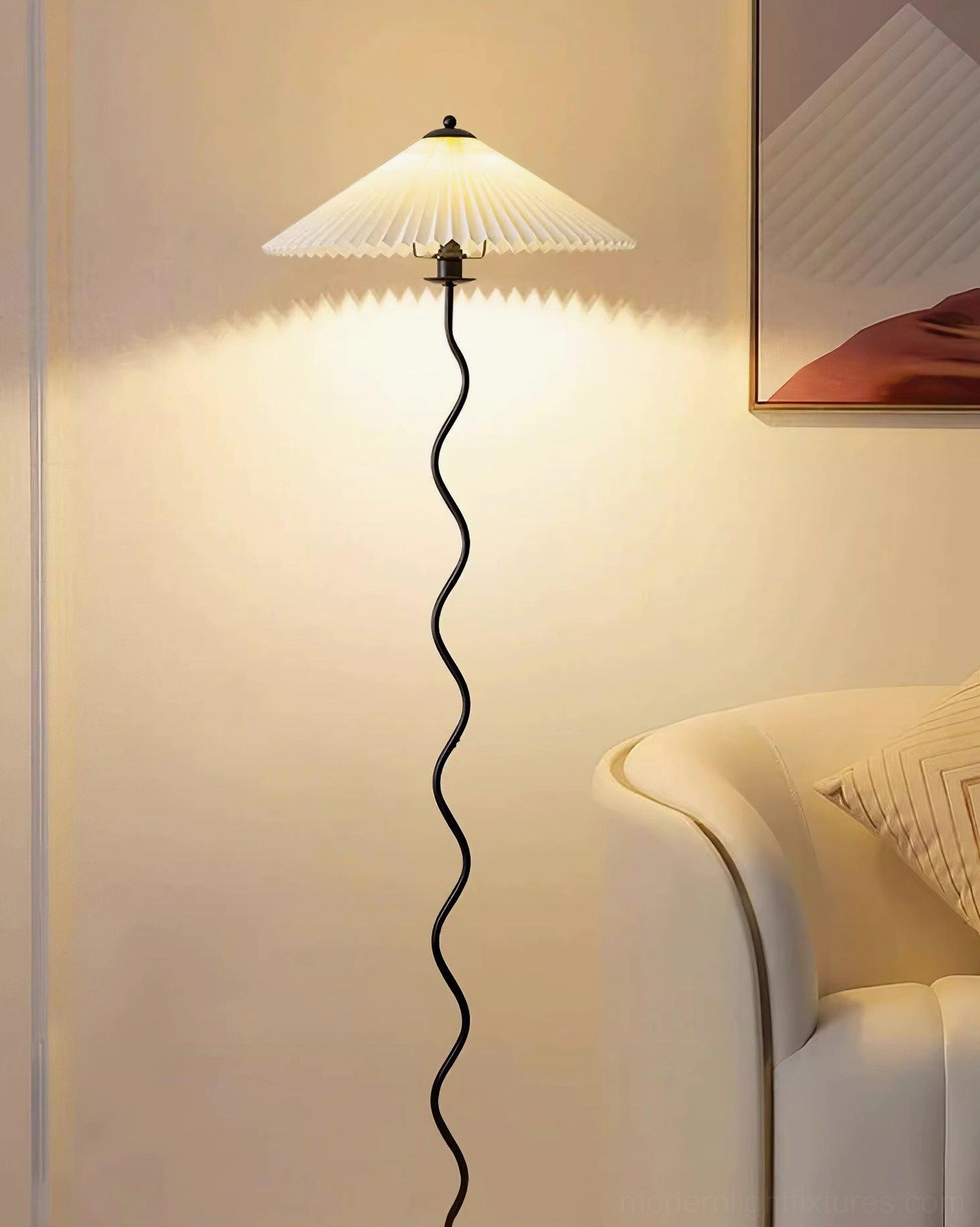 Squiggle floor lamp beside modern sofa - contemporary lighting design in stylish living room setting