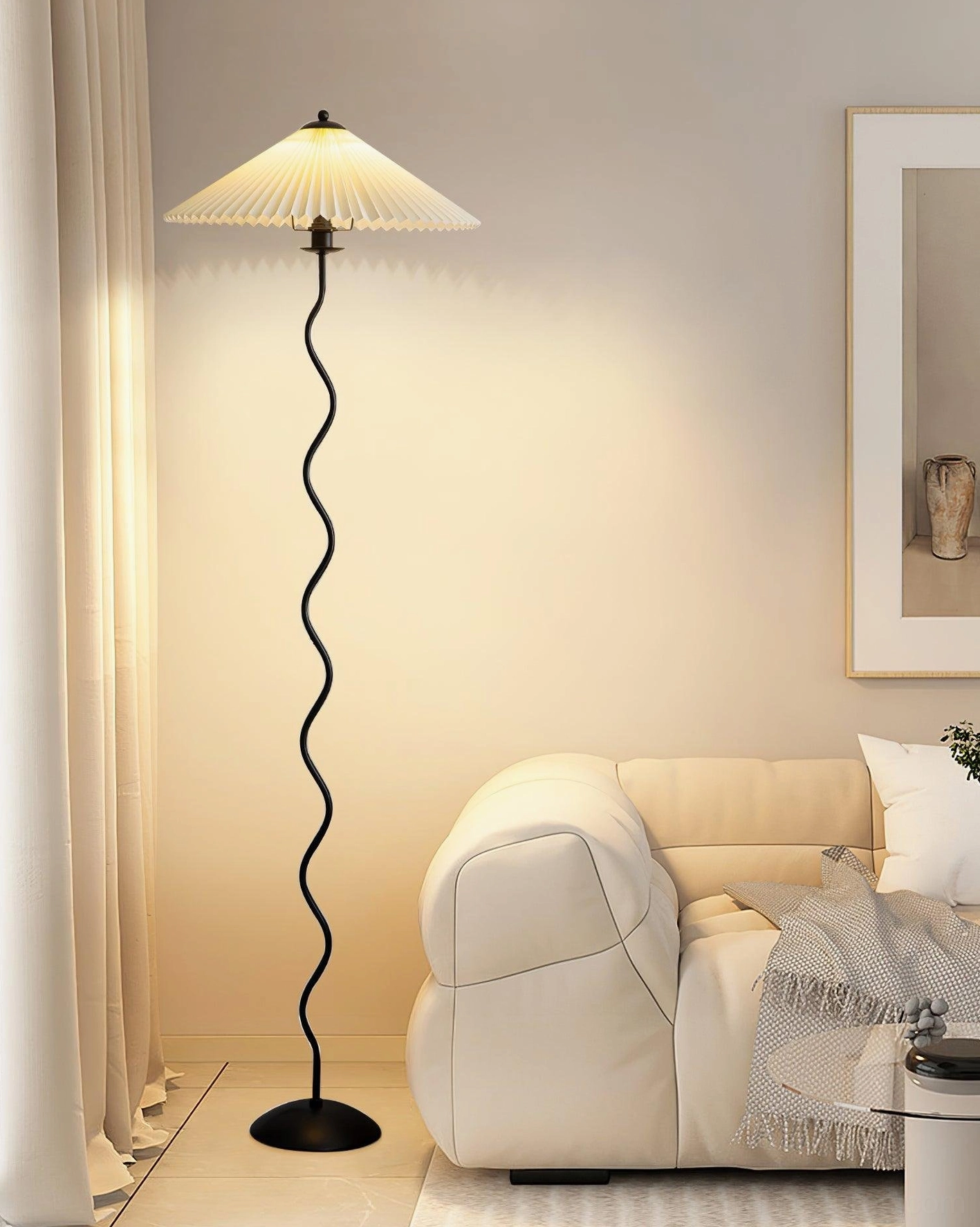 Sculptural wave floor lamp beside beige fabric sofa - mid-century modern lighting in minimalist living room design