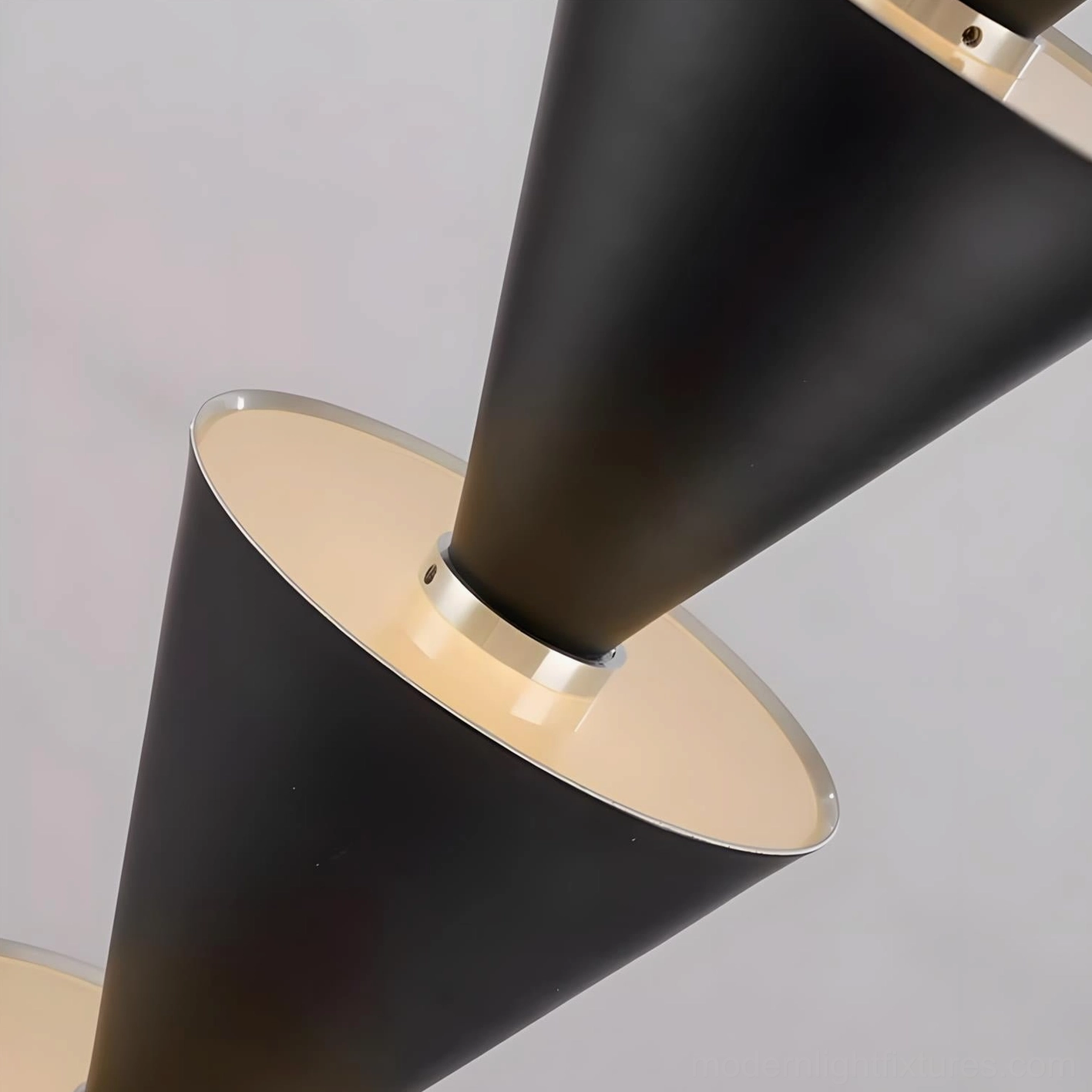 Stacked cone pendant light detail showing metal cone construction and LED light bands