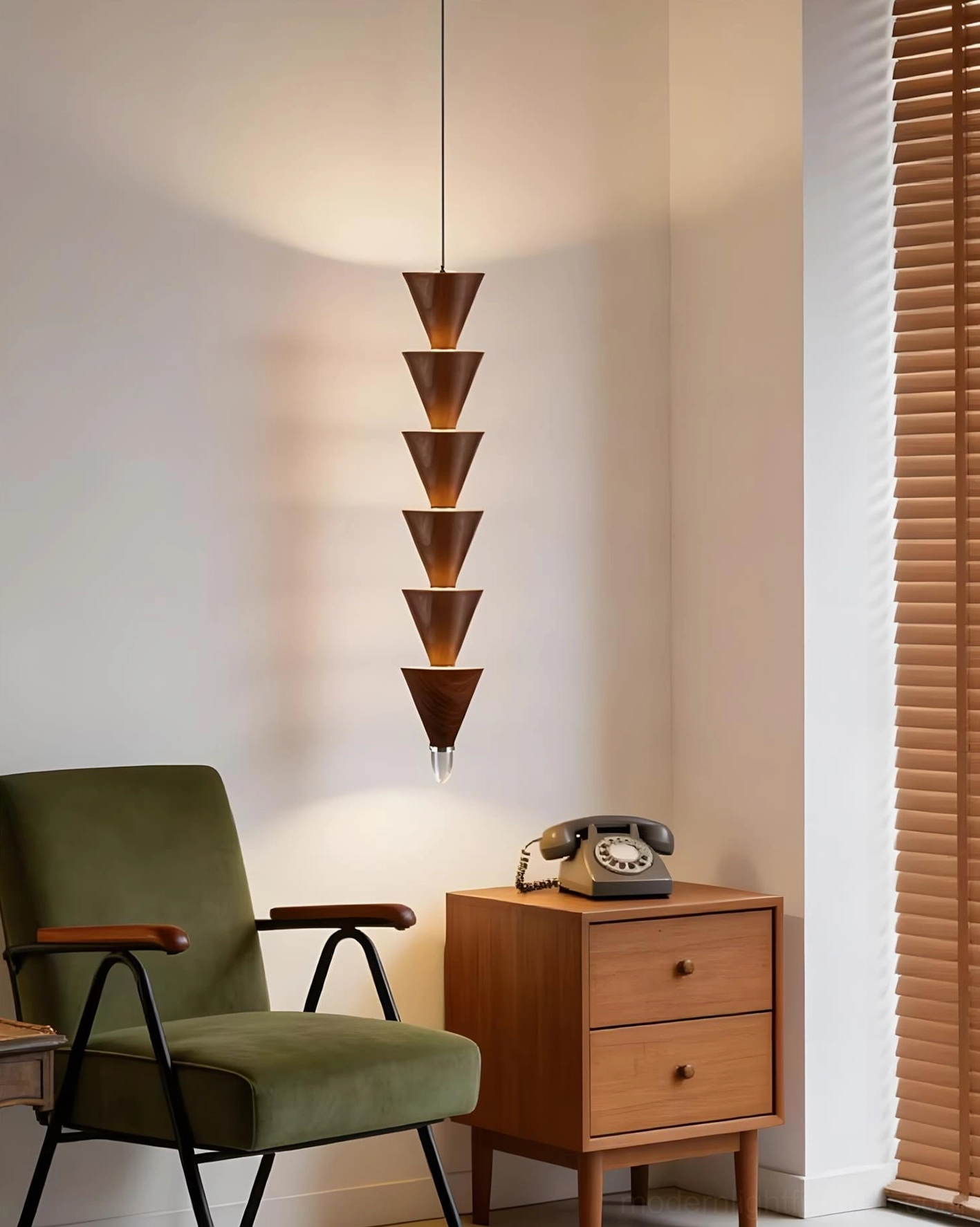 Modern stacked cone pendant hanging in mid-century modern lounge with vintage furniture and warm ambient lighting