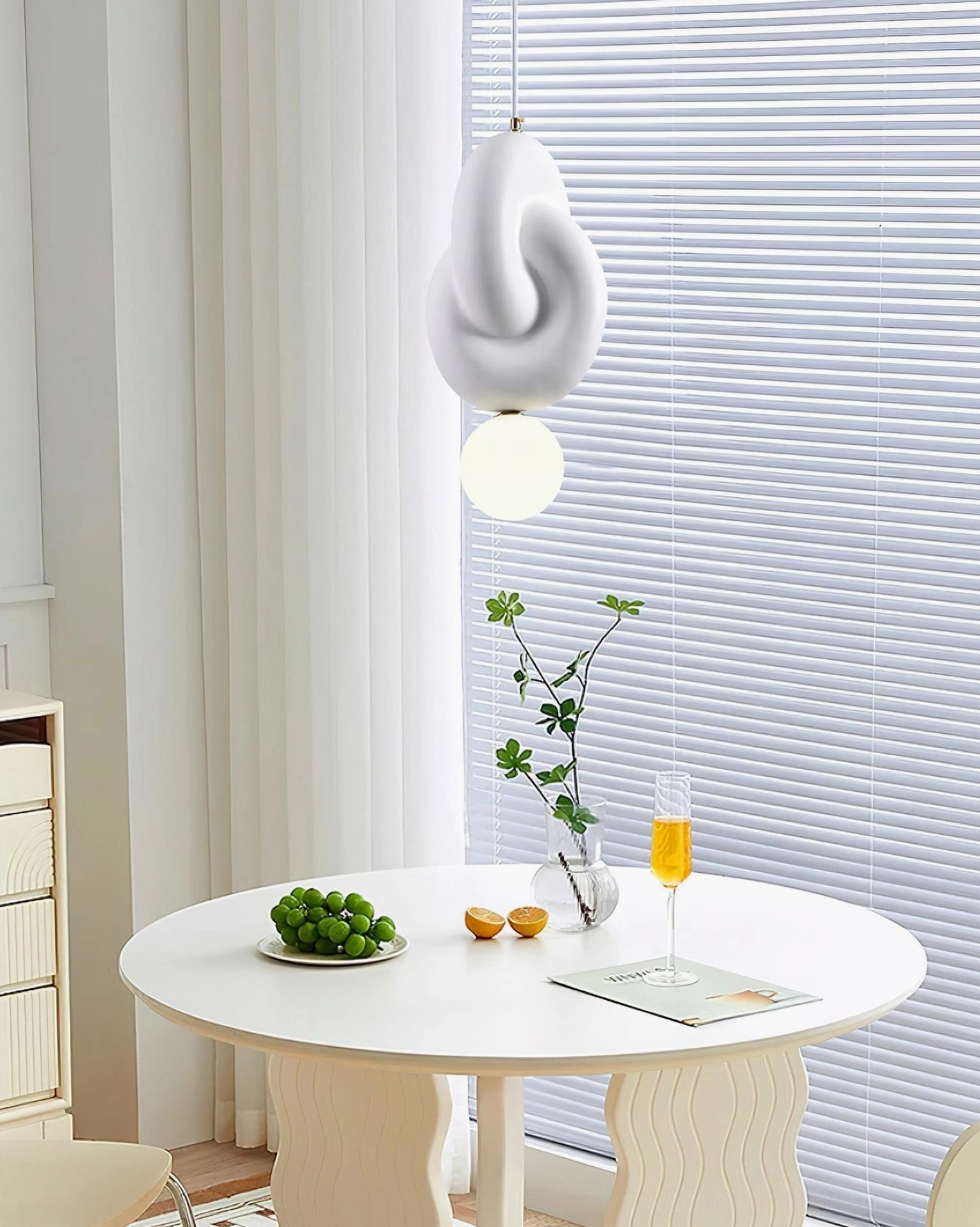 Modern pendant light with stacked white discs and adjustable wire, contemporary architectural lighting design