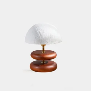 Stacked wood ring table lamp with brass accents and soft textured dome shade front view modern minimalist design