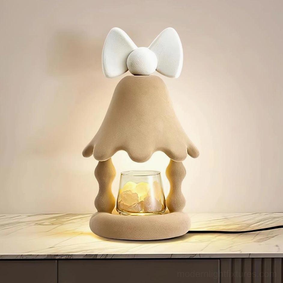 Stacy candle warmer lamp detail close-up showing flocked resin body texture and integrated LED warm light glow