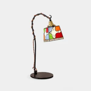 Stained glass arc table lamp with dove motif, front view on white background, black metal frame with twisted cord