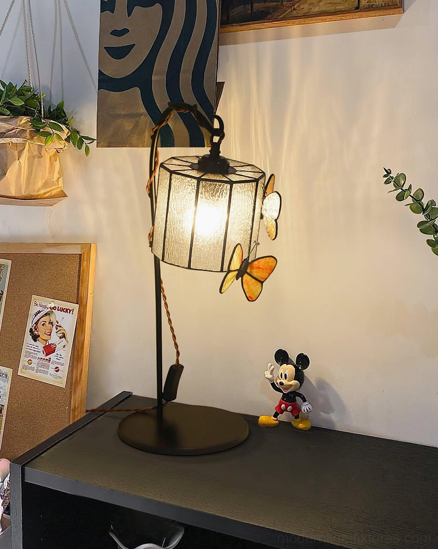 Stained glass butterfly table lamp with frosted square shade on home office desktop