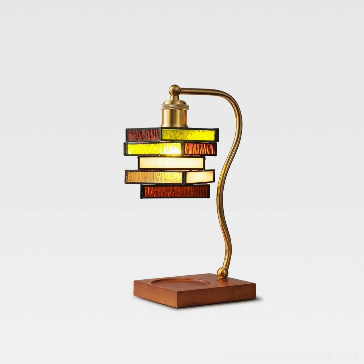 Left side profile of stained glass lamp showing curved brass arm and solid wooden base with geometric shade