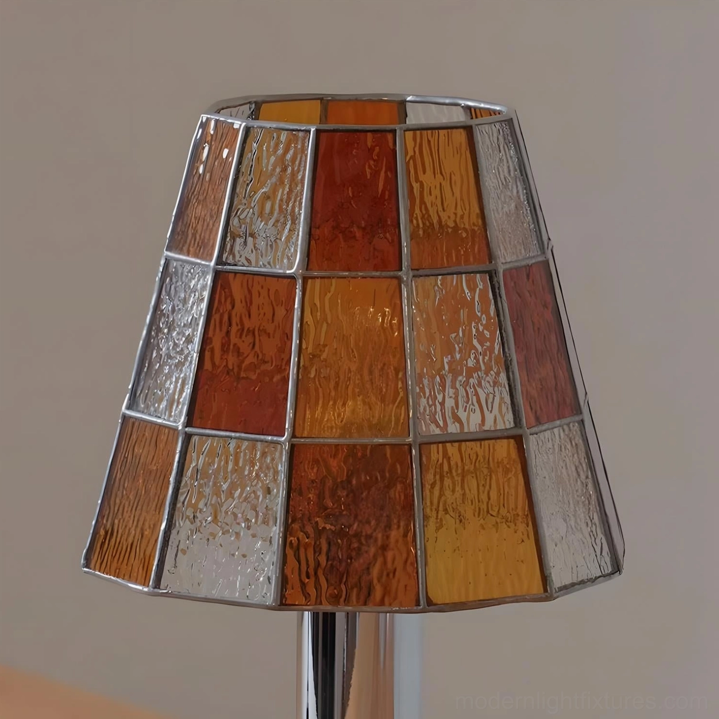 Contemporary glass table lamp close-up showcasing colored glass mosaic craftsmanship and light refraction