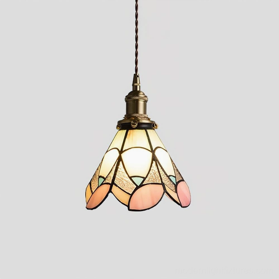 Stained glass pendant lamp shade detail featuring vibrant colored glass panels and traditional brass soldering technique