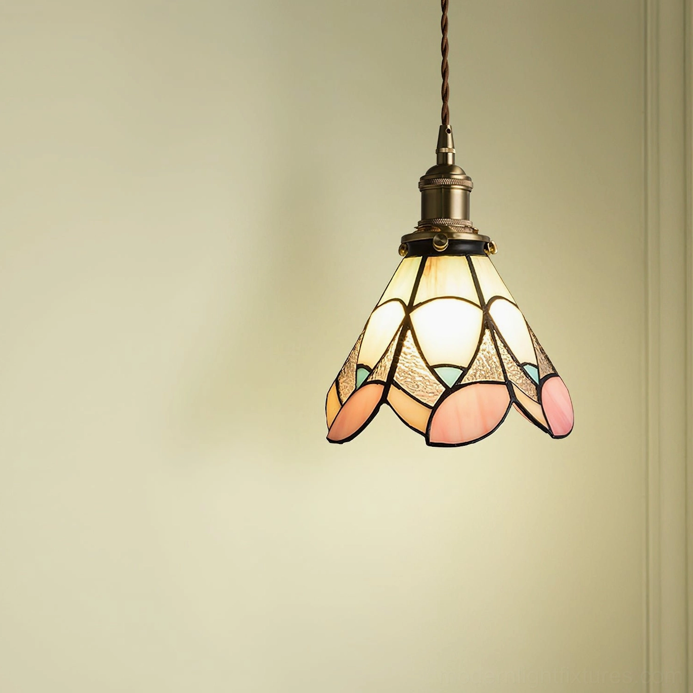 Stained glass pendant light with warm ambient glow, three-quarter angle showing petal glass shade and vintage brass fixtures