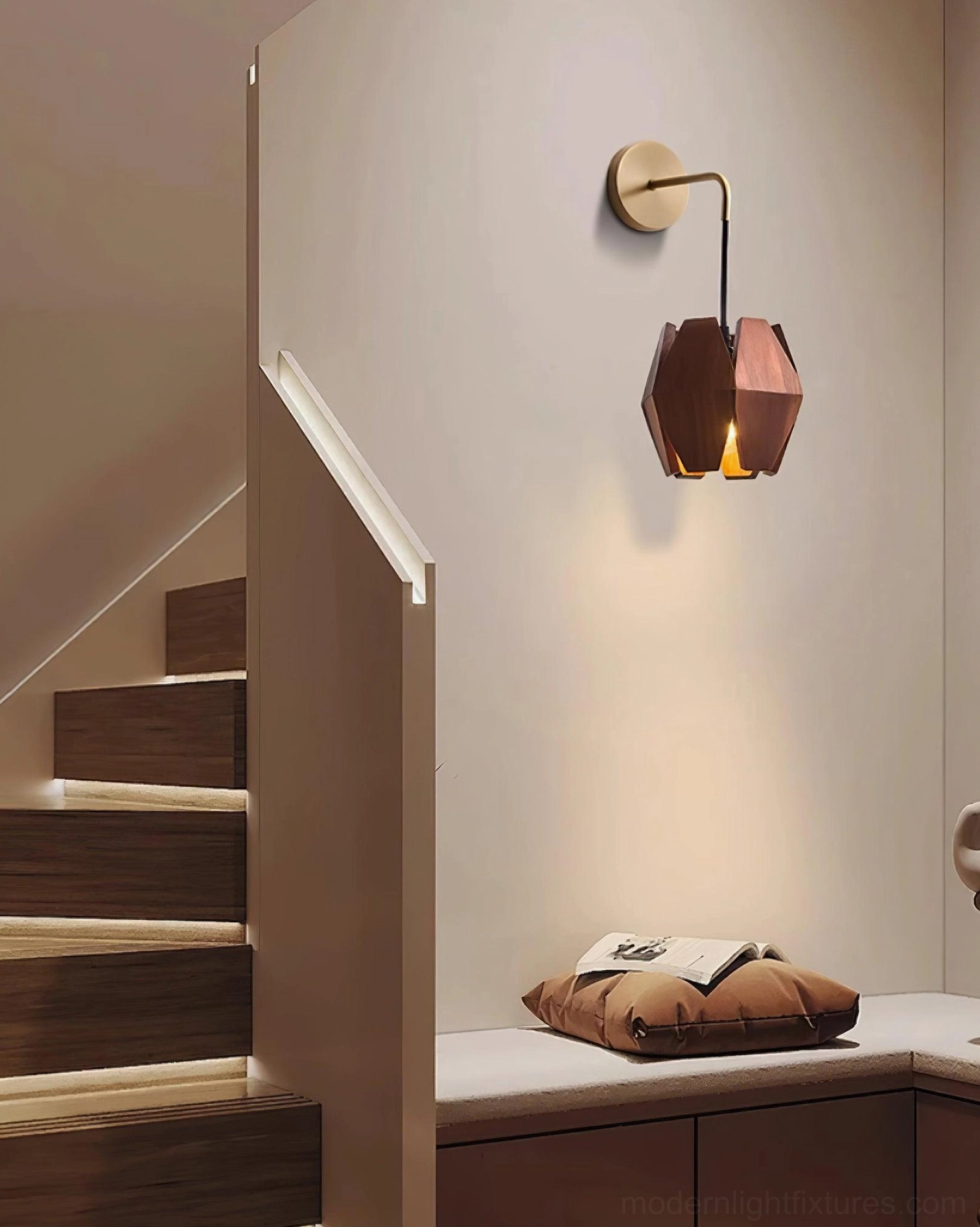 Geometric wood wall sconce installed on stairwell accent wall providing hallway ambient light
