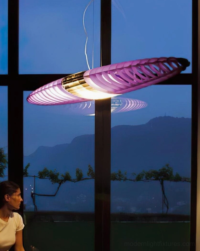 Star Ship pendant lamp suspended from adjustable wire in open-plan living space