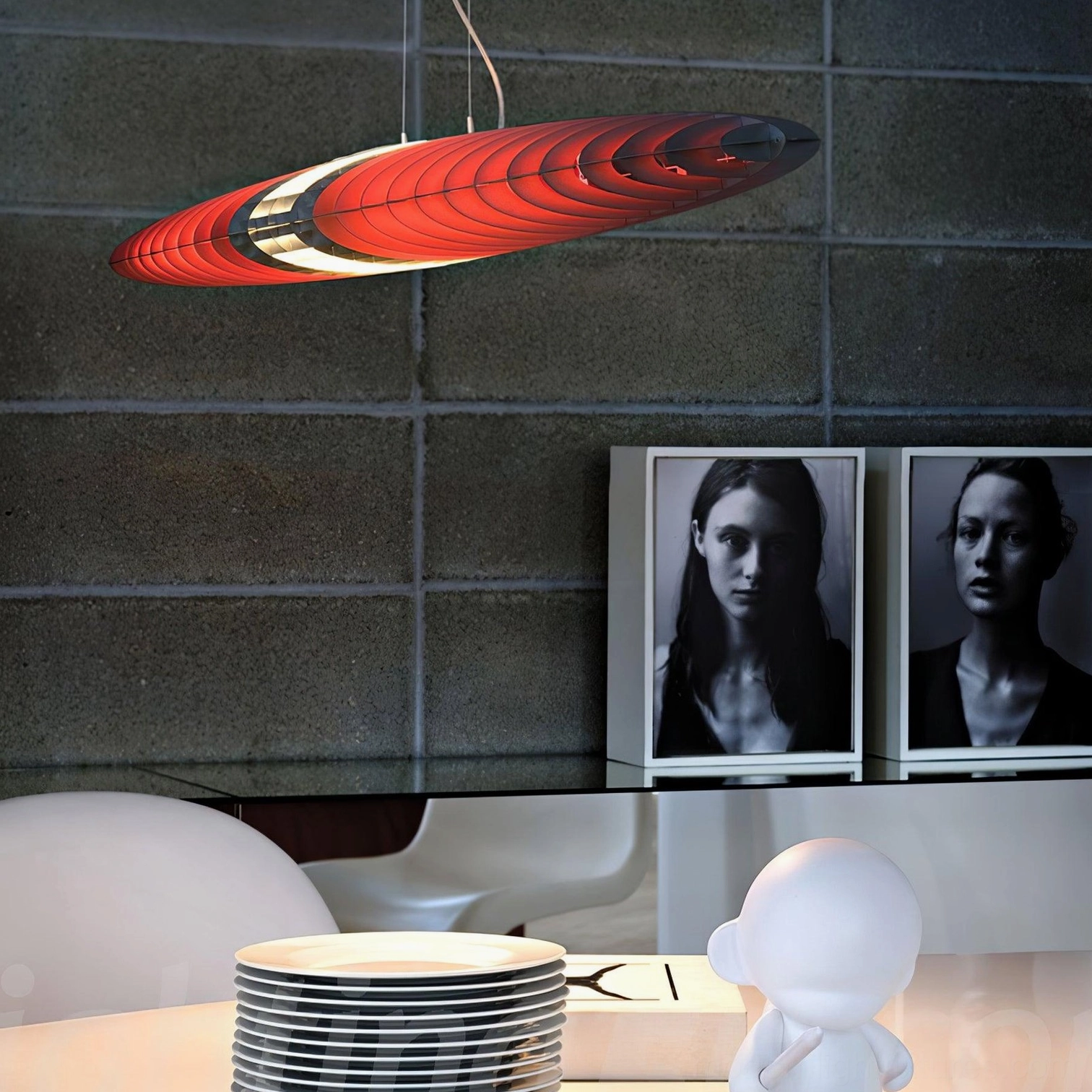 Star Ship modern pendant lamp with full red slatted oval structure in residential dining area