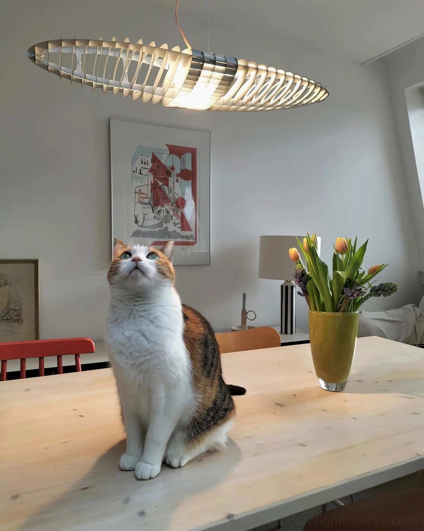 Star Ship chrome pendant lamp with warm neutral slatted shade in residential dining room interior