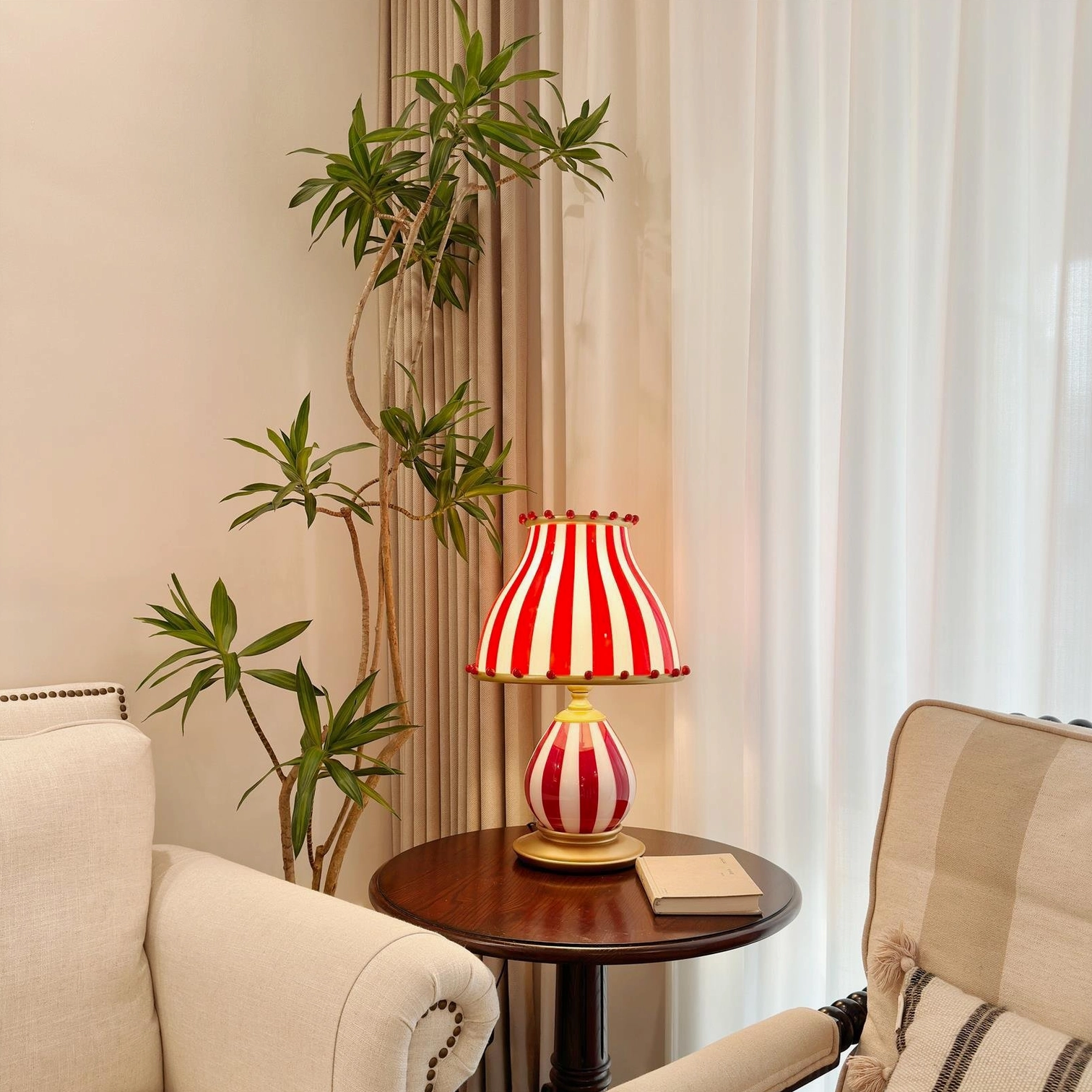 Statement table lamp with carnival circus aesthetic and artistic light diffusion