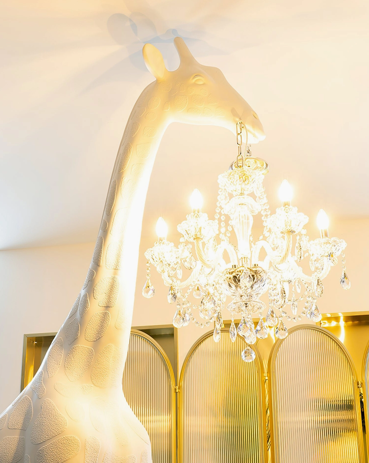 Statement giraffe sculpture floor lamp with bold artistic form and illuminated crystal chandelier elements