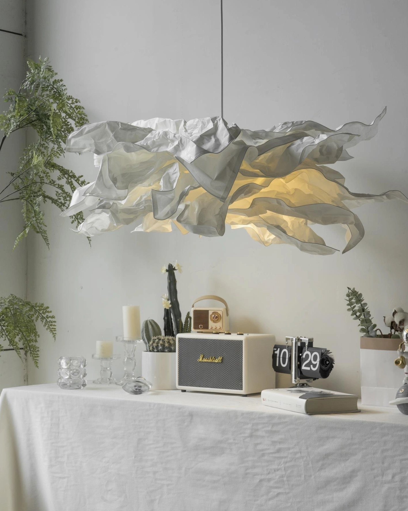 Statement handcrafted paper pendant lamp as focal point in modern minimalist interior design