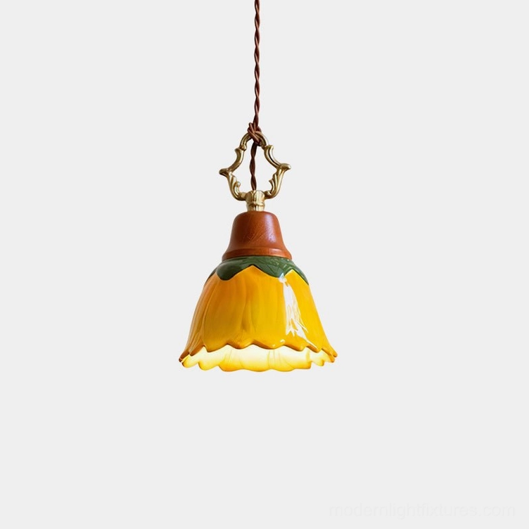 Stella hand-glazed ceramic pendant light with scalloped sunflower shade, front overhead view on white background
