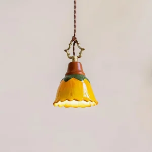 Stella pendant lamp ceramic shade detail shot, flower-shaped design on neutral background