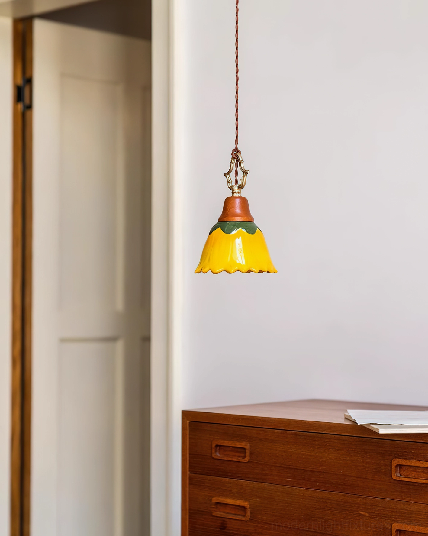 Stella pendant light installed in rustic cottage interior with wooden furniture and vintage décor