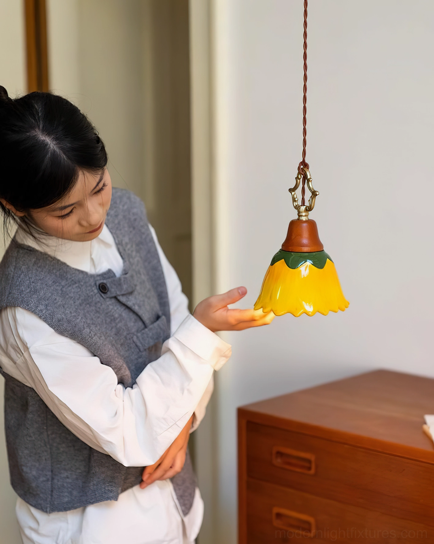 Stella pendant light lifestyle shot with person in residential interior space