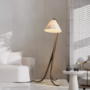 Scandinavian floor lamp in modern living room with sofa, warm neutral home decor and wabi-sabi aesthetic