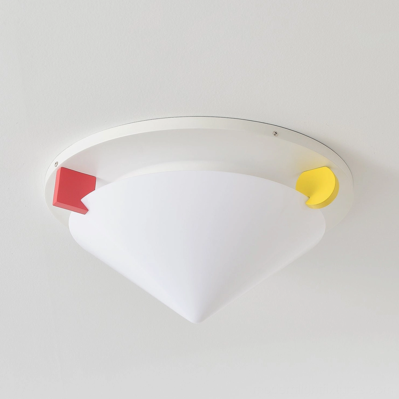 Stoja geometric ceiling lamp wall-mounted postmodern design close-up showing white metal frame with red and yellow accent blocks