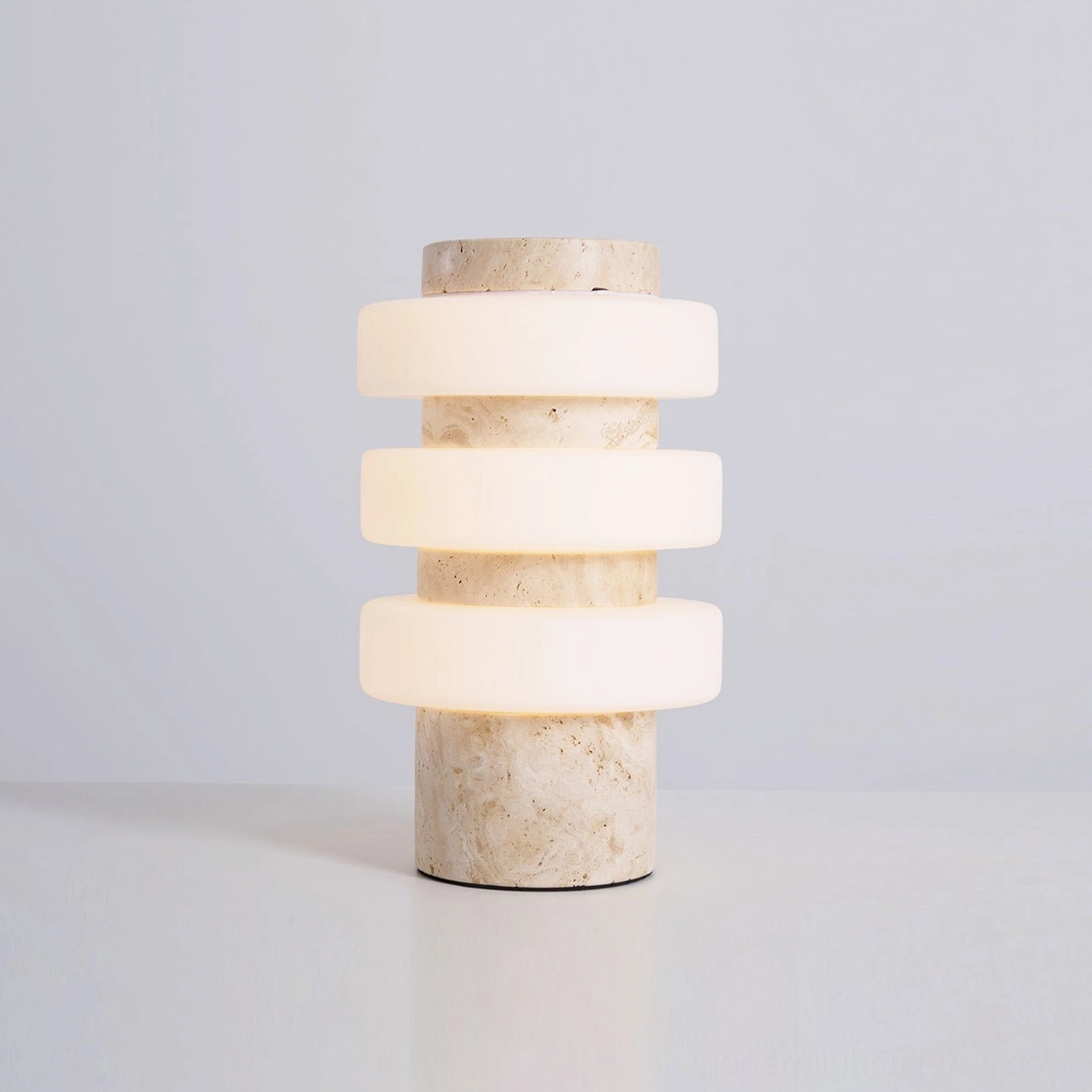 Strata modern sculptural table lamp displaying architectural tiered ring design in living space
