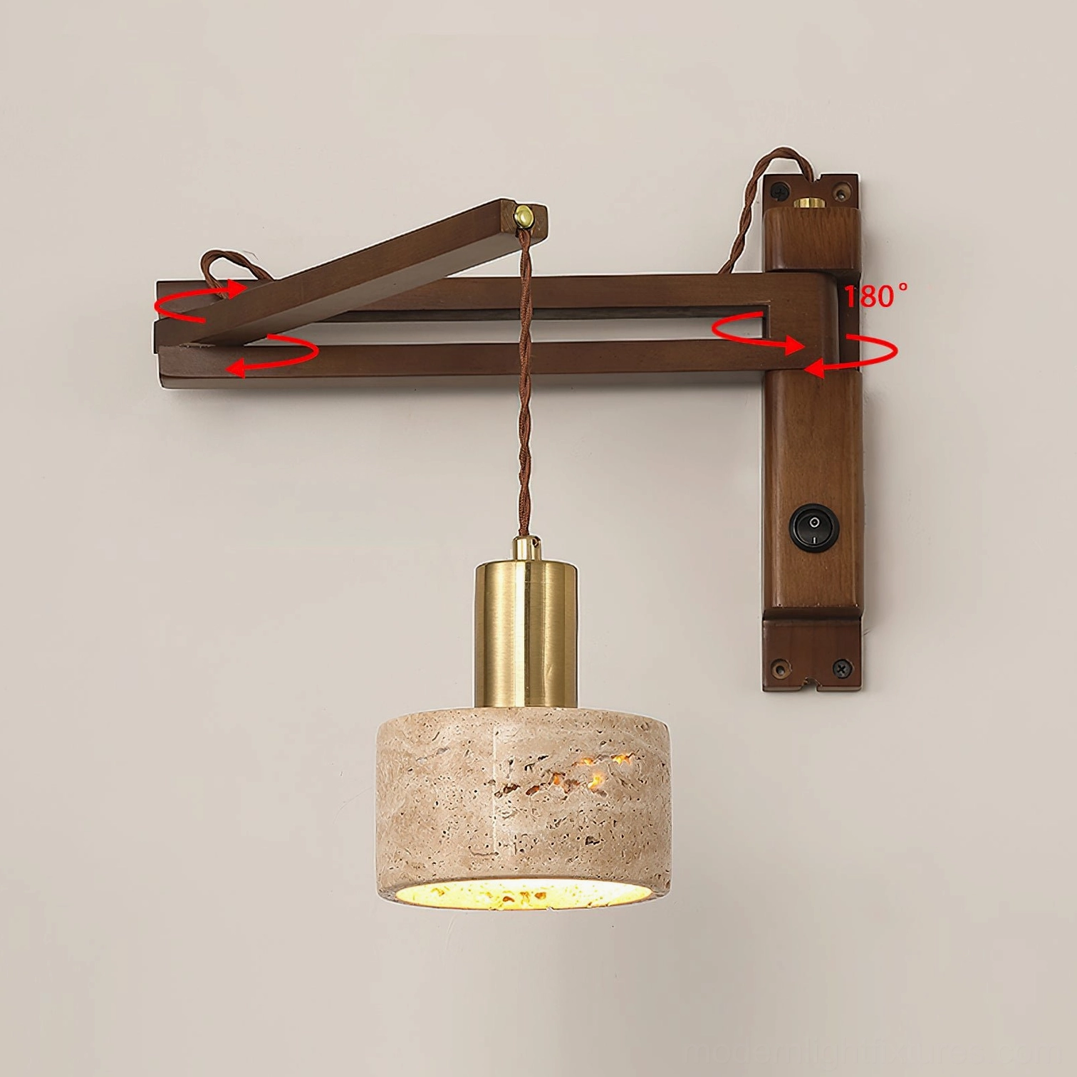 Modern swing arm wall sconce in studio setting, wooden bracket with brass accents and cylindrical travertine lampshade