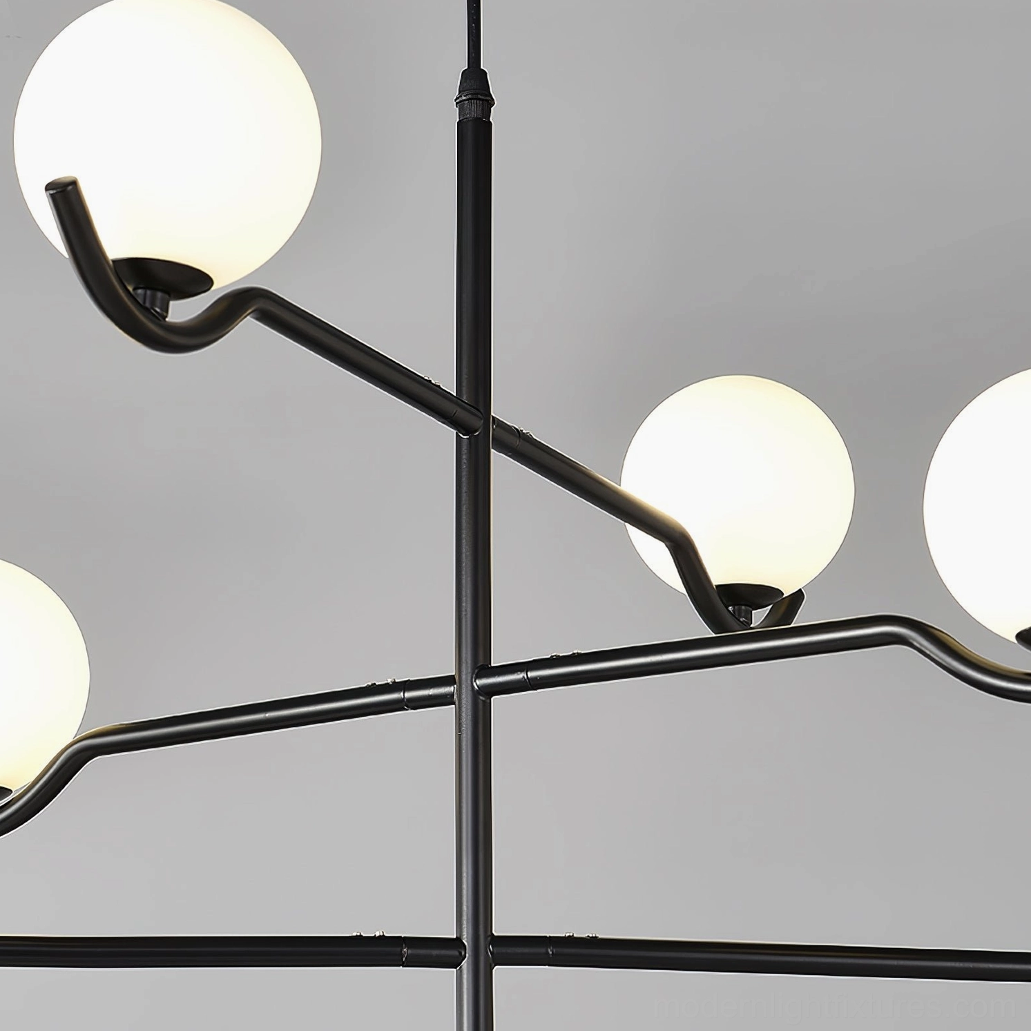 Sullivan Sputnik Chandelier detail view of frosted opal glass globe and metal arm connection