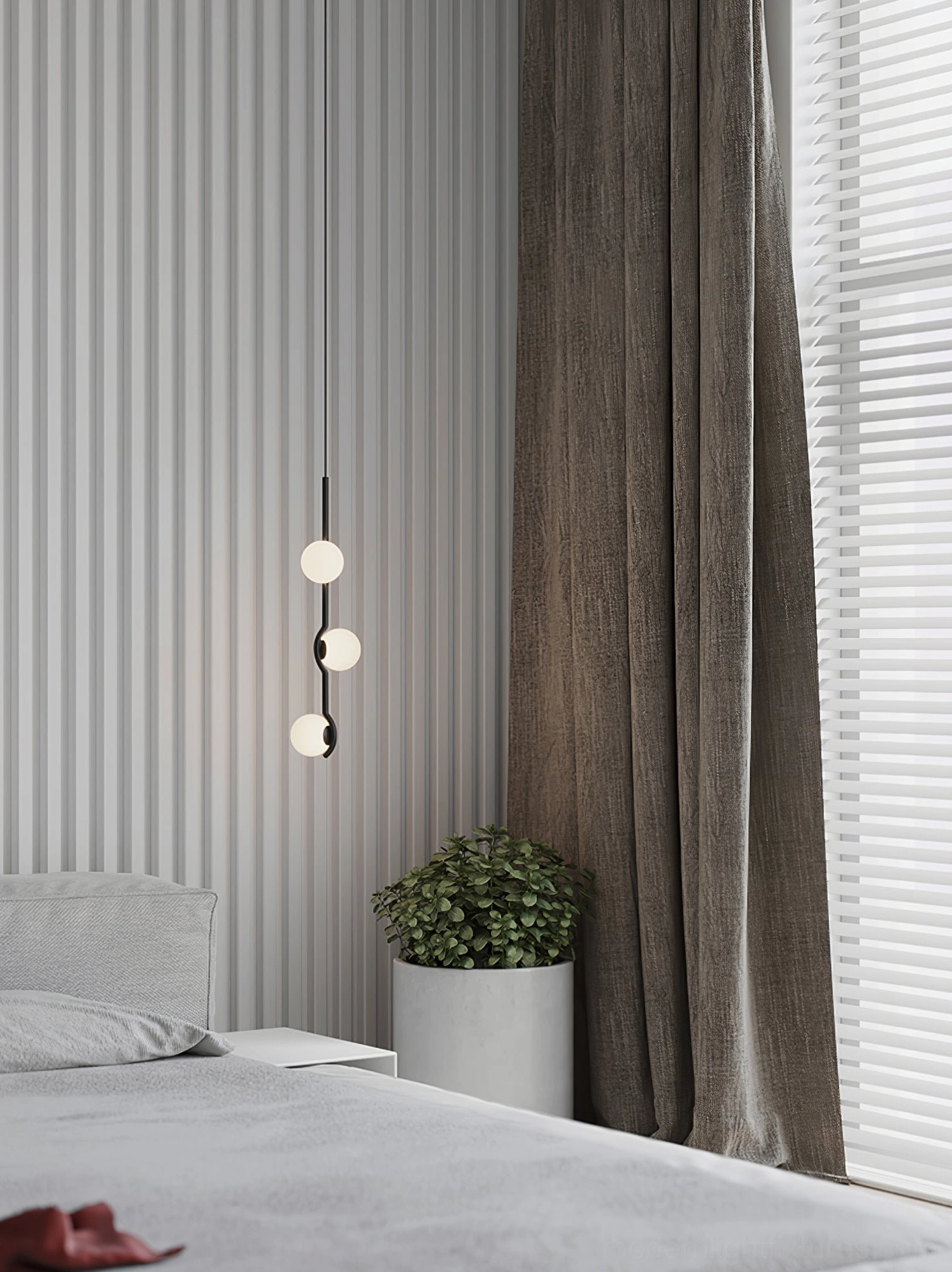 Asymmetrical modern pendant fixture creating sophisticated focal point in dining or living areas