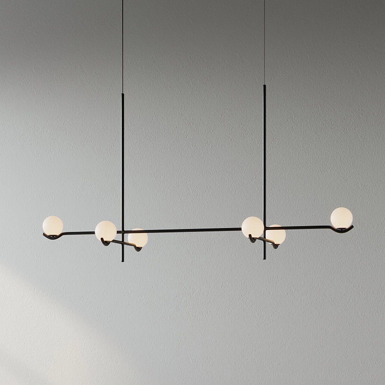 Multi-head sputnik chandelier with frosted glass orbs creating warm diffused ambient lighting